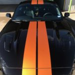 Longhorn Orange race stripes added to black Mustang GT